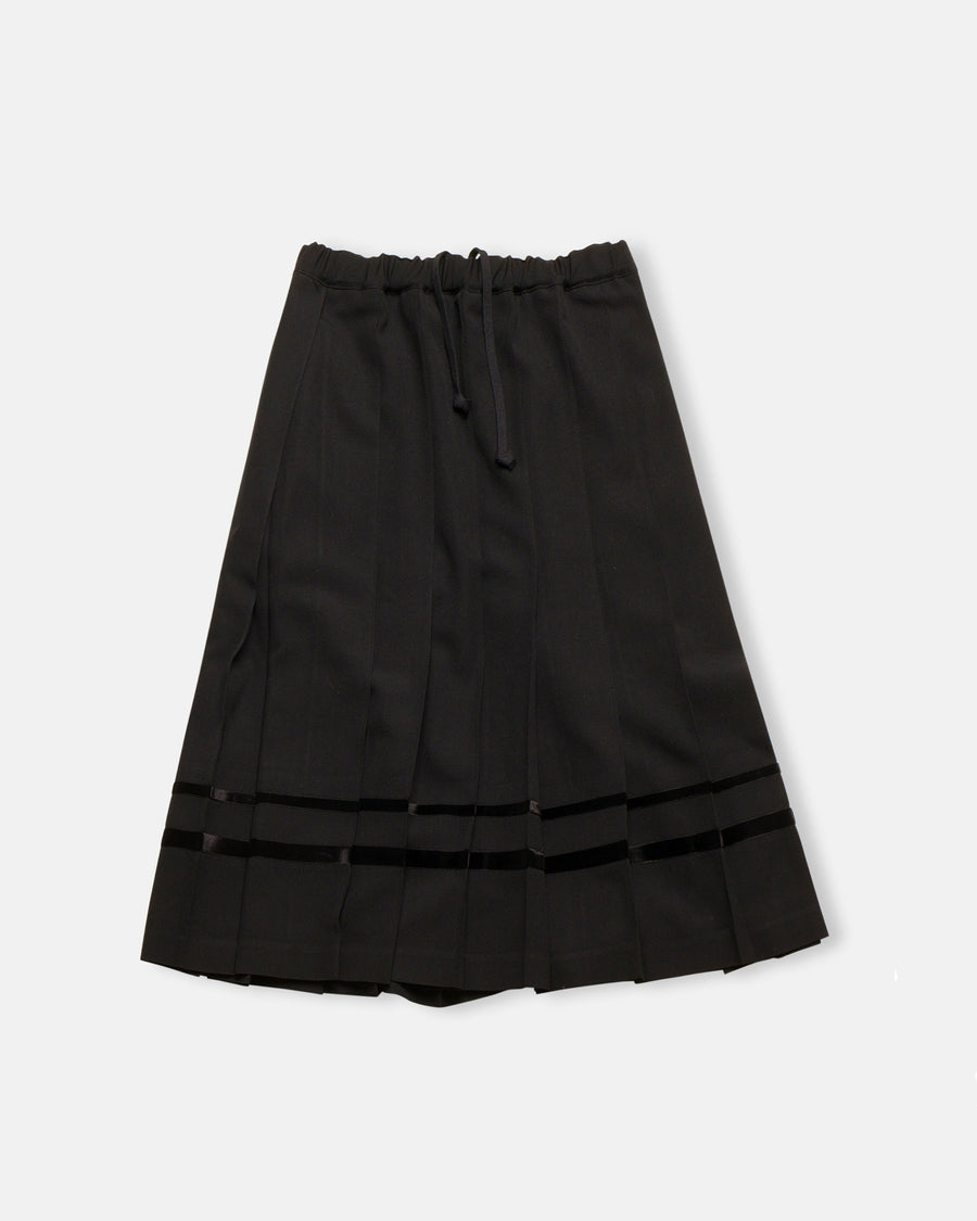 pleated skirt with velveteen trim